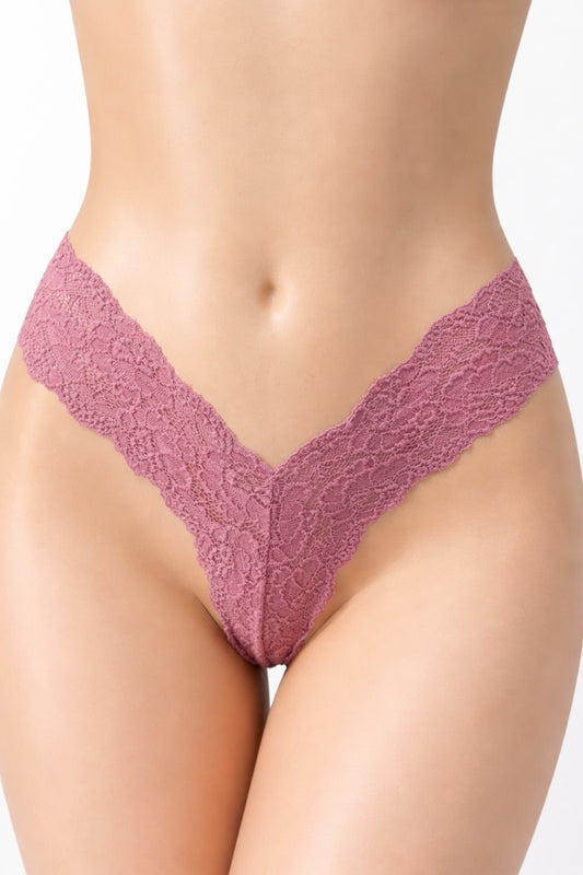 Lace underwear worn by a model on a white background