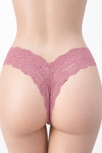 Pink lace lingerie on a plain background