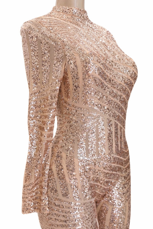 champagne gold sequin dress on a mannequin against a white background