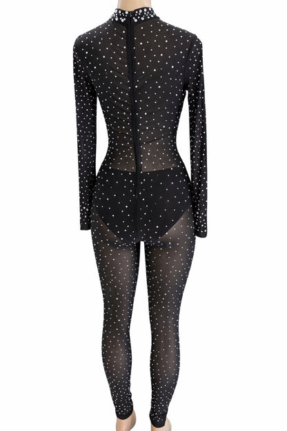 Black rhinestone jumpsuit with sheer overlay on a white background