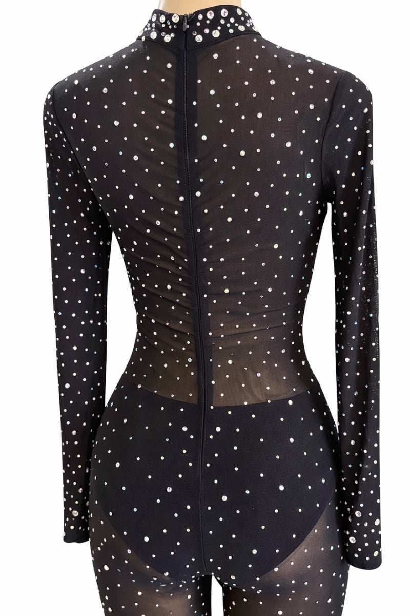 Black outfit with rhinestones on a mannequin against a white background