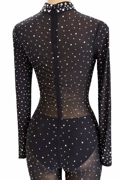 Black outfit with rhinestones on a mannequin against a white background