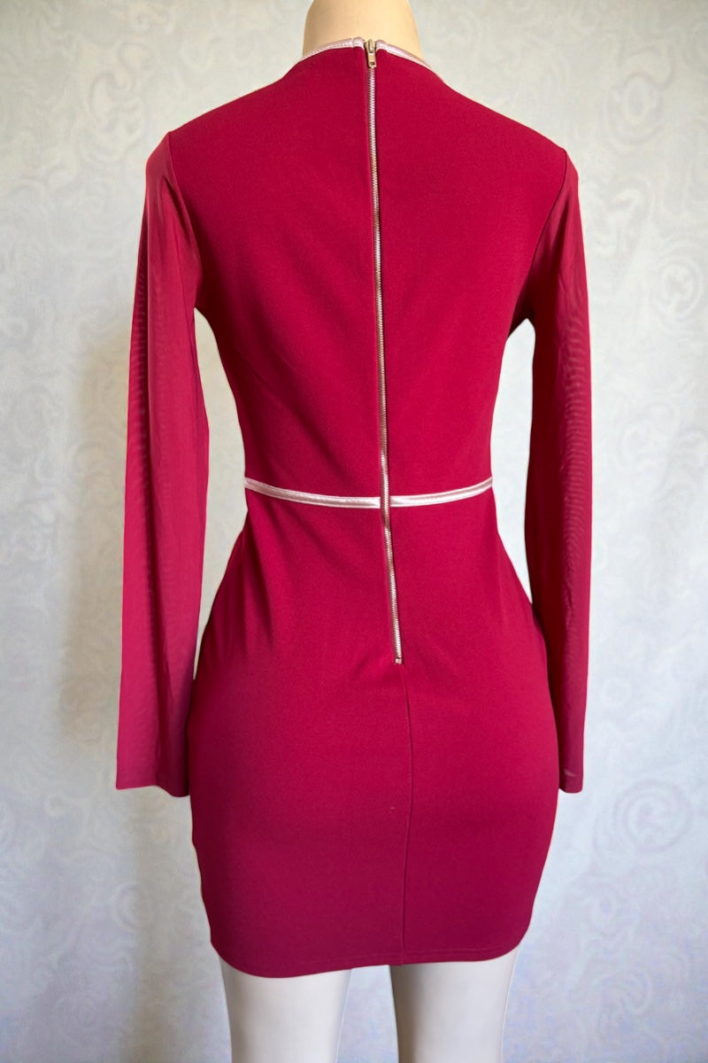 Burgundy dress with a zipper on a mannequin against a light background