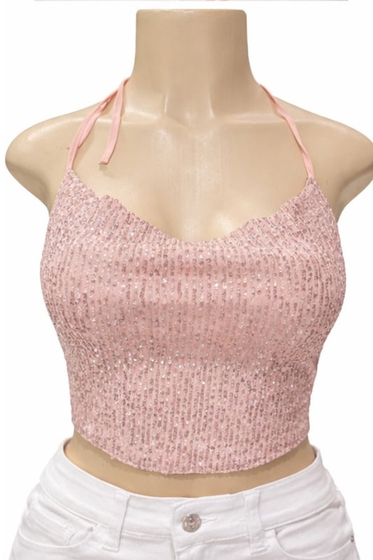 Pink crop top on a mannequin with a white background