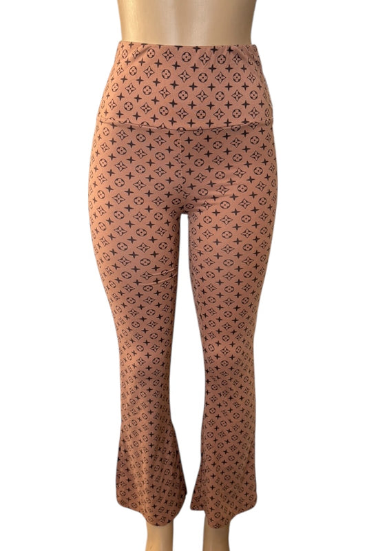 Patterned leggings on a mannequin against a white background