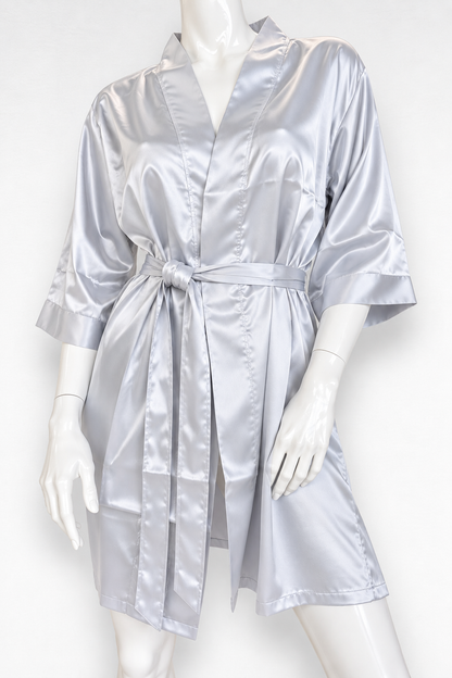 A silver satin robe displayed on a white mannequin against a plain white background.