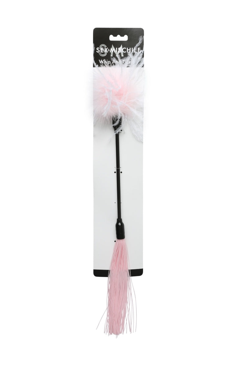 Pink feathered object with tassel on a white background, branded 'Sex Whistle'.