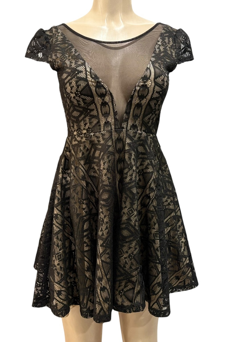 Black lace dress on a mannequin against a white background
