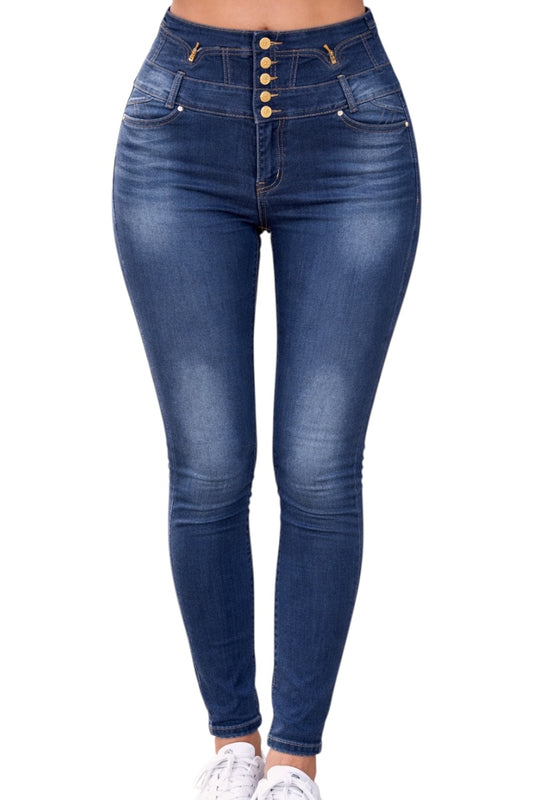 Blue jeans with button details on a white background