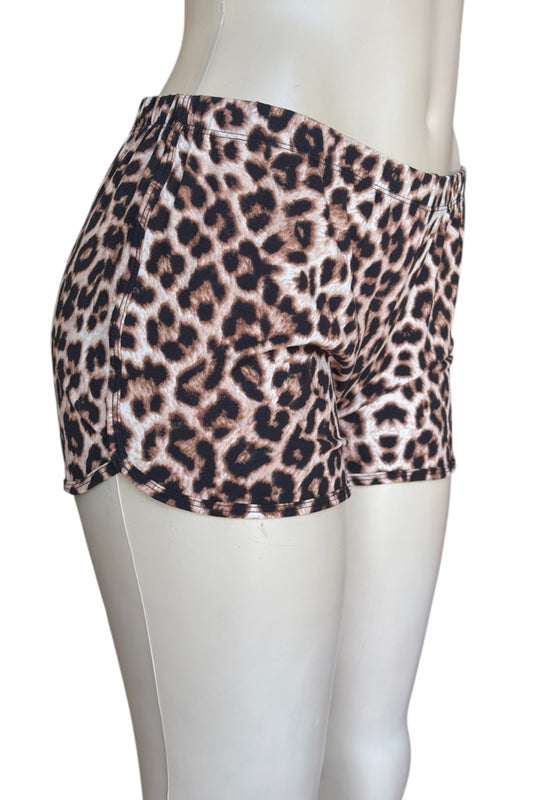 Leopard print shorts on a mannequin against a white background