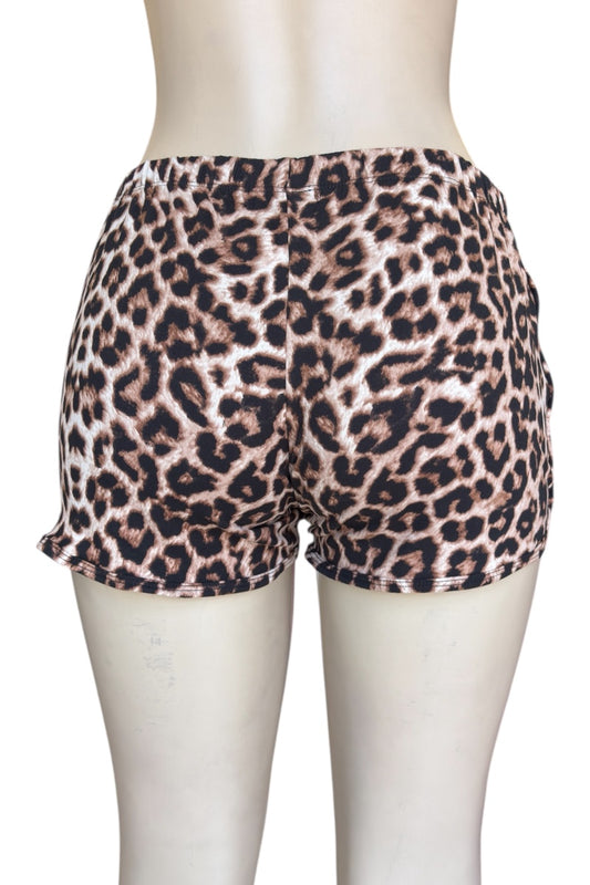 Leopard print shorts on a mannequin against a white background