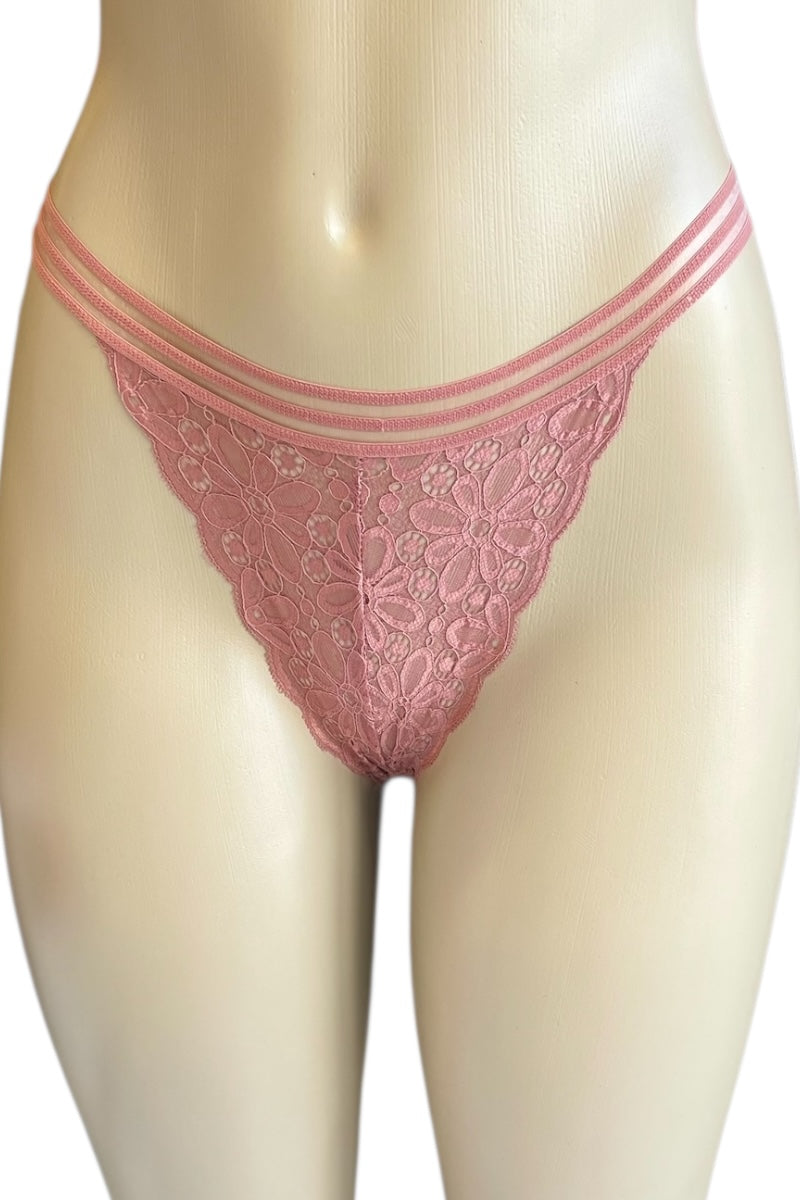Pink lace thong on a mannequin against a white background