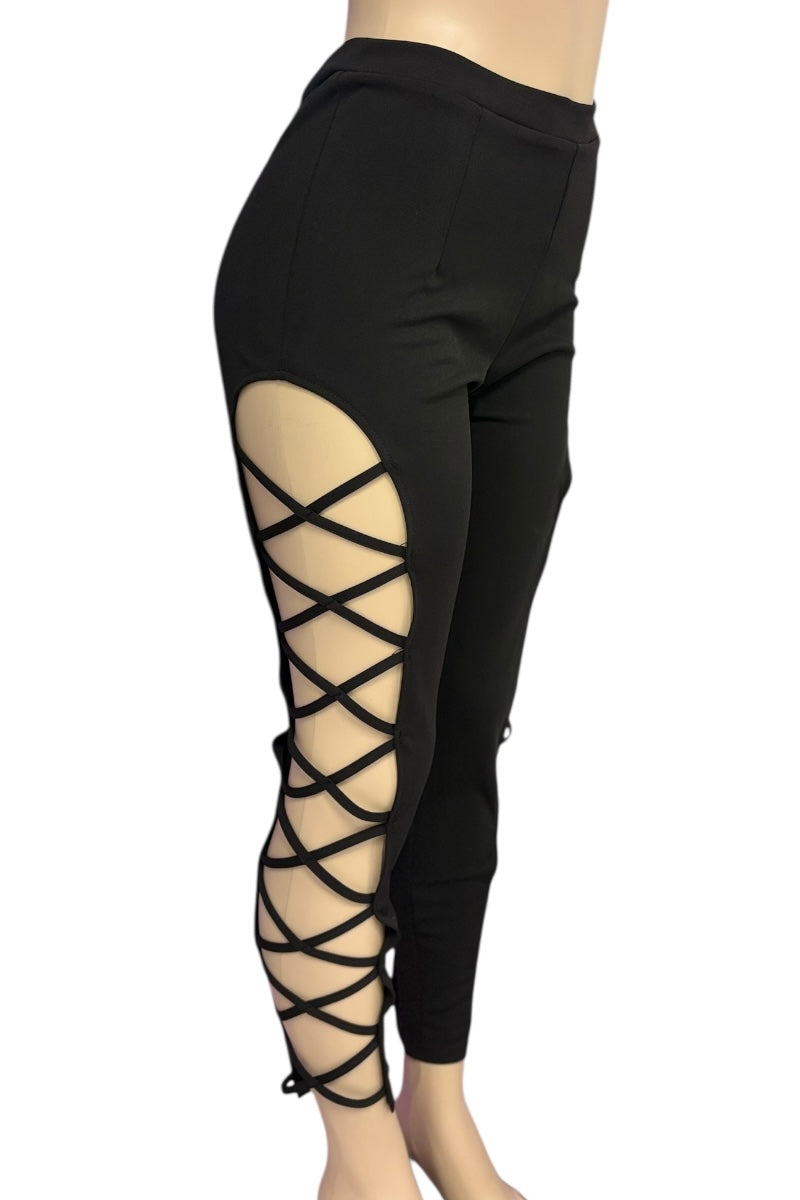 Black leggings with crisscross lace-up design on a white background