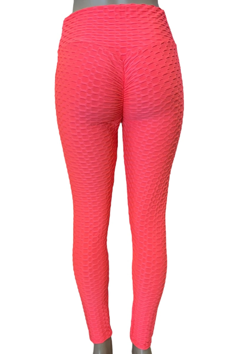 coral textured leggings on a white background