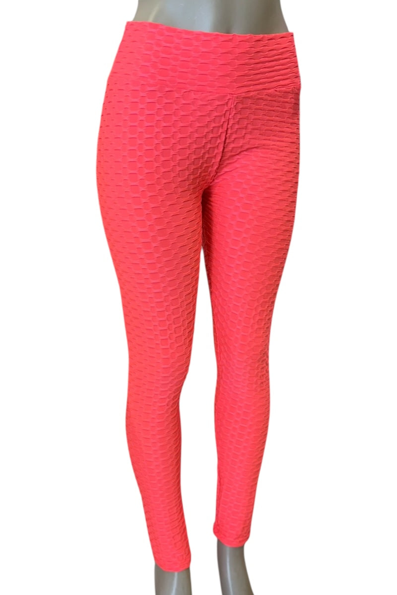 coral leggings on a mannequin against a white background