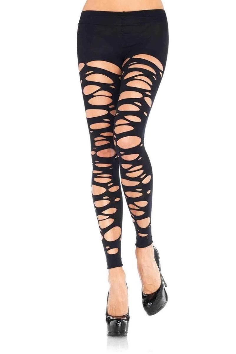 Black leggings with a circular cutout pattern on the legs, shown on a model wearing black high heels against a white background.
