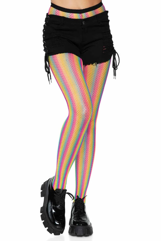 A person from waist to feet wearing black shorts with lace-up details, rainbow-striped fishnet tights, and black chunky platform boots against a plain white background.