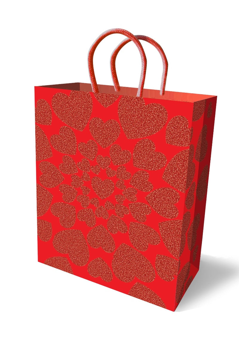 Red gift bag with heart pattern on a white background