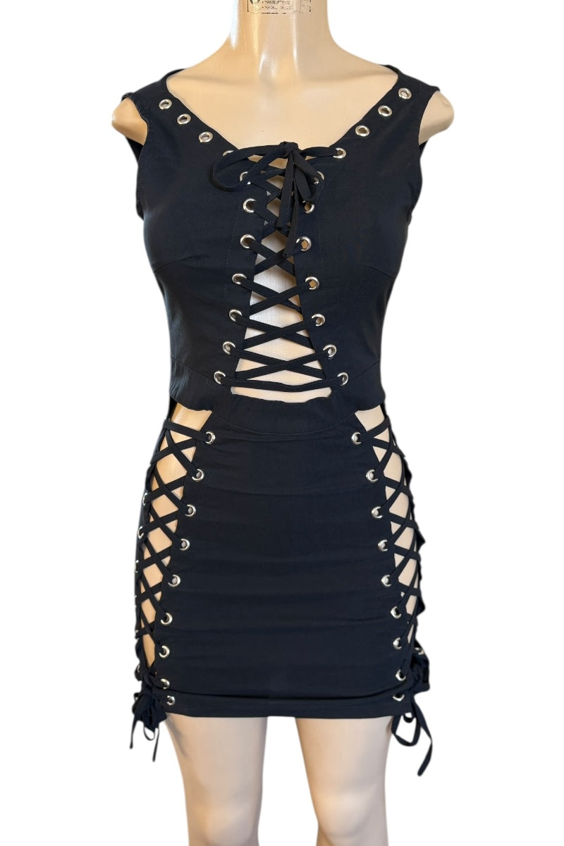 Black lace-up dress on a mannequin against a white background
