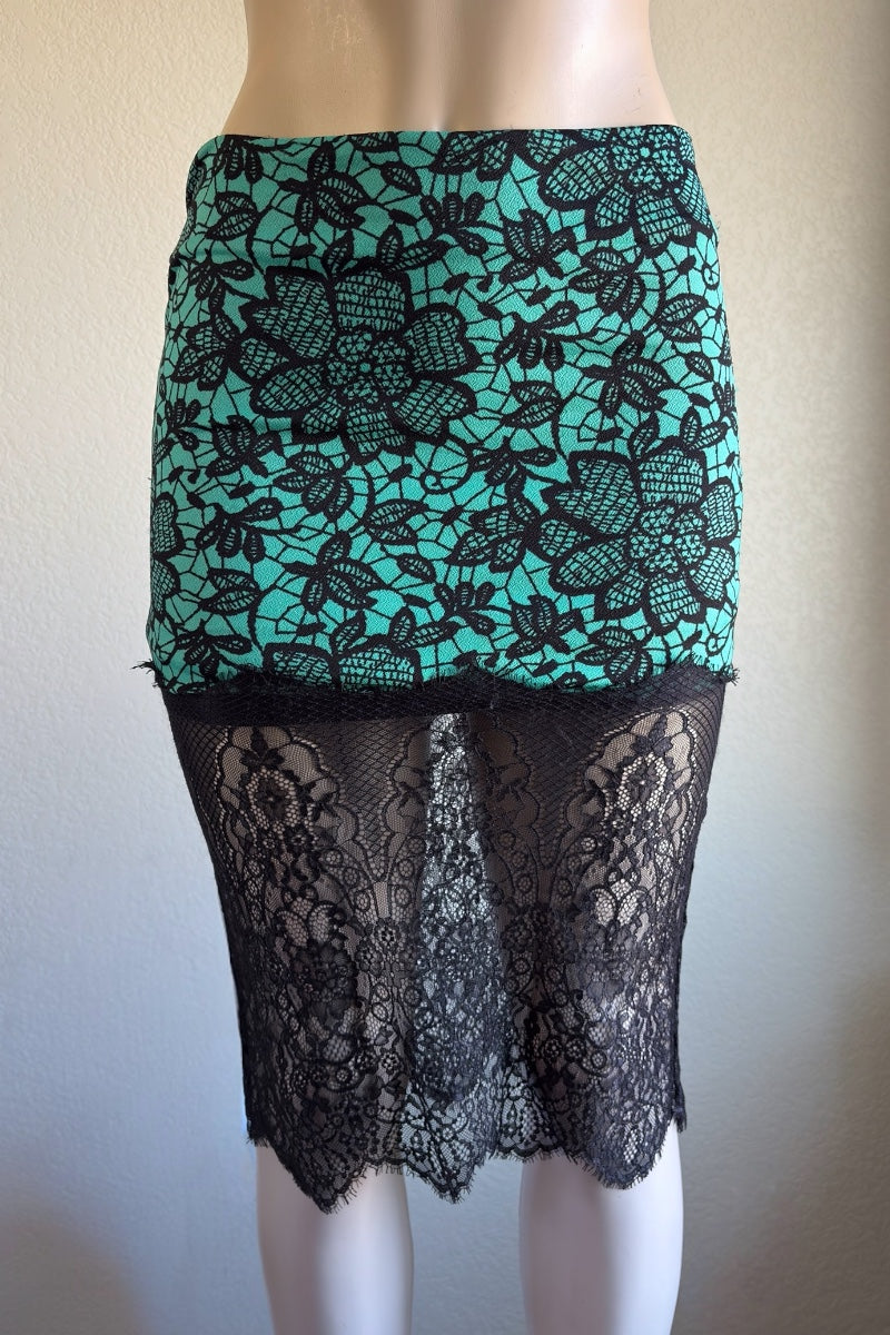 Skirt with black lace overlay on a mannequin against a neutral background