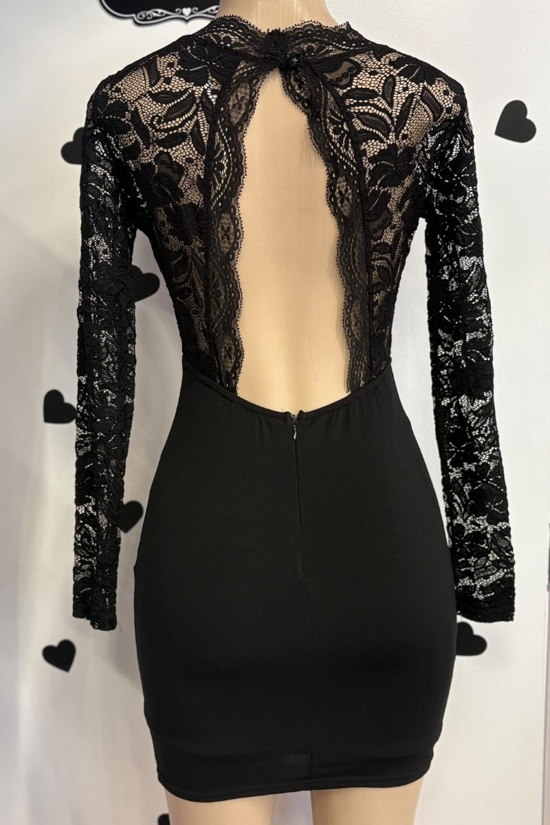 Black lace long-sleeve dress on a mannequin against a white background.