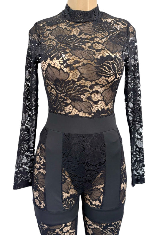 Black lace long-sleeve jumpsuit on a mannequin against a white background