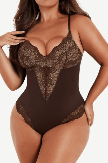Brown lace bodysuit worn by a model on a plain background