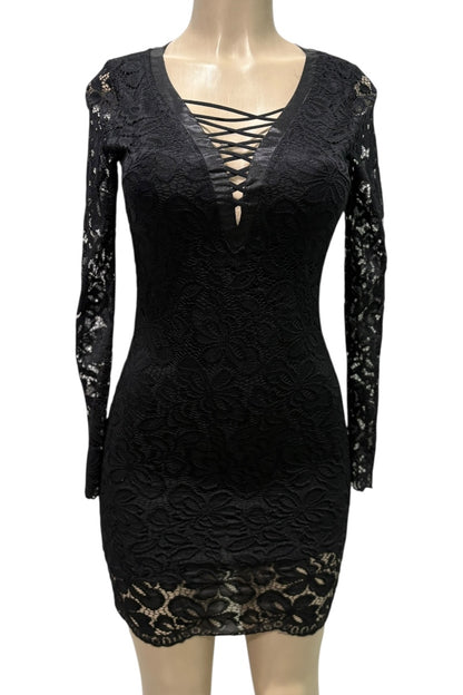 Black lace dress on a mannequin against a white background