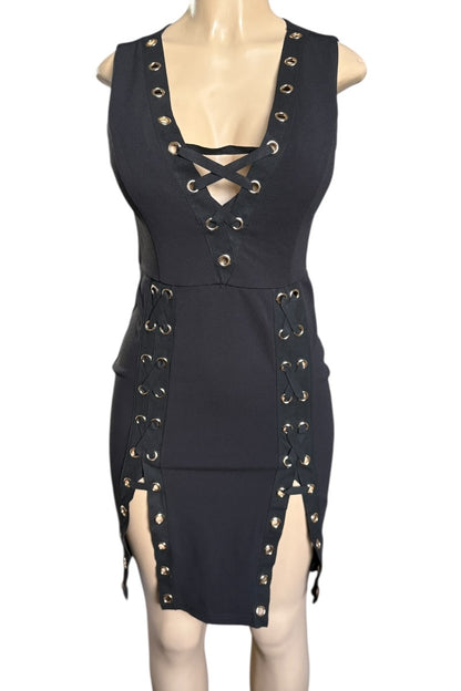Black dress with gold eyelets on a mannequin against a white background