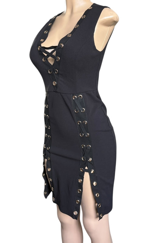Black dress with gold buttons on a mannequin against a white background