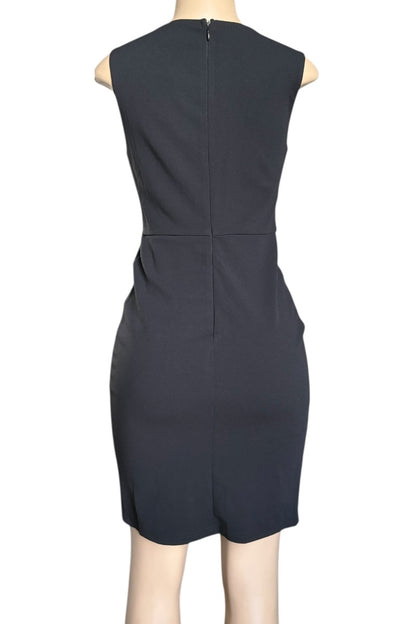 Black sleeveless dress on a mannequin against a white background