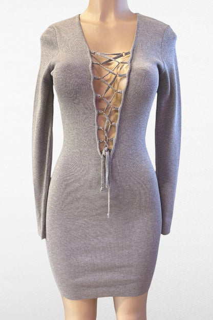 Mannequin wearing a gray lace-up dress on a white background