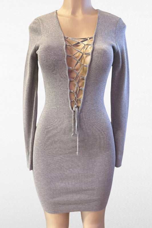 Mannequin wearing a gray lace-up dress on a white background