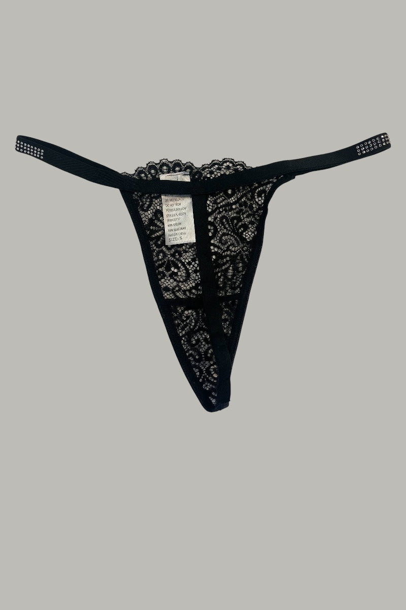 Black lace thong on a gray background