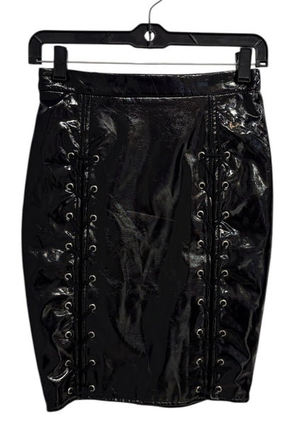 Black lace-up skirt on a hanger against a white background