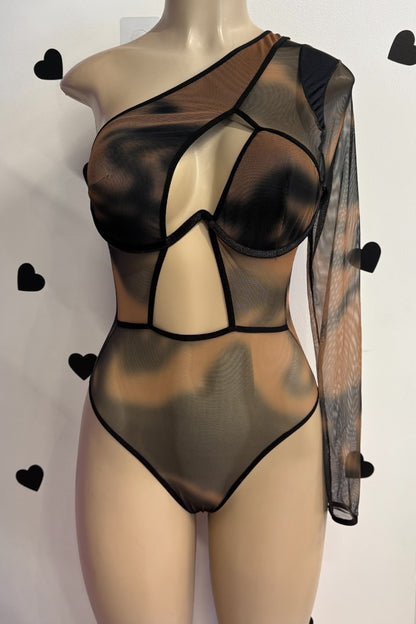 Sheer black bodysuit on a mannequin against a white background with black heart shapes.