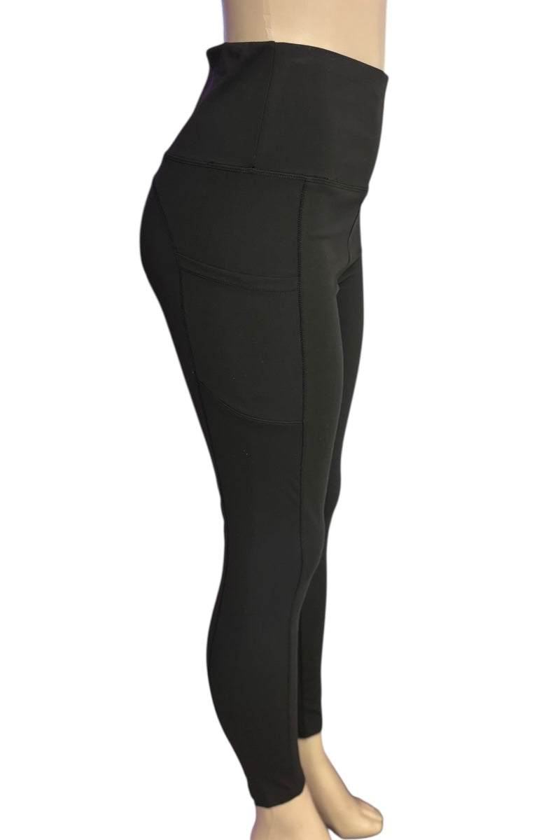 Black leggings worn by a mannequin on a white background