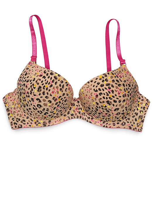 Leopard print bra with pink straps on a white background
