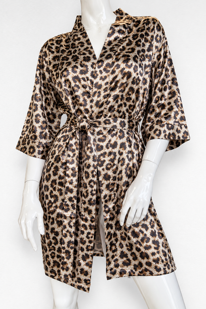 A leopard print satin robe displayed on a white mannequin against a plain white background.