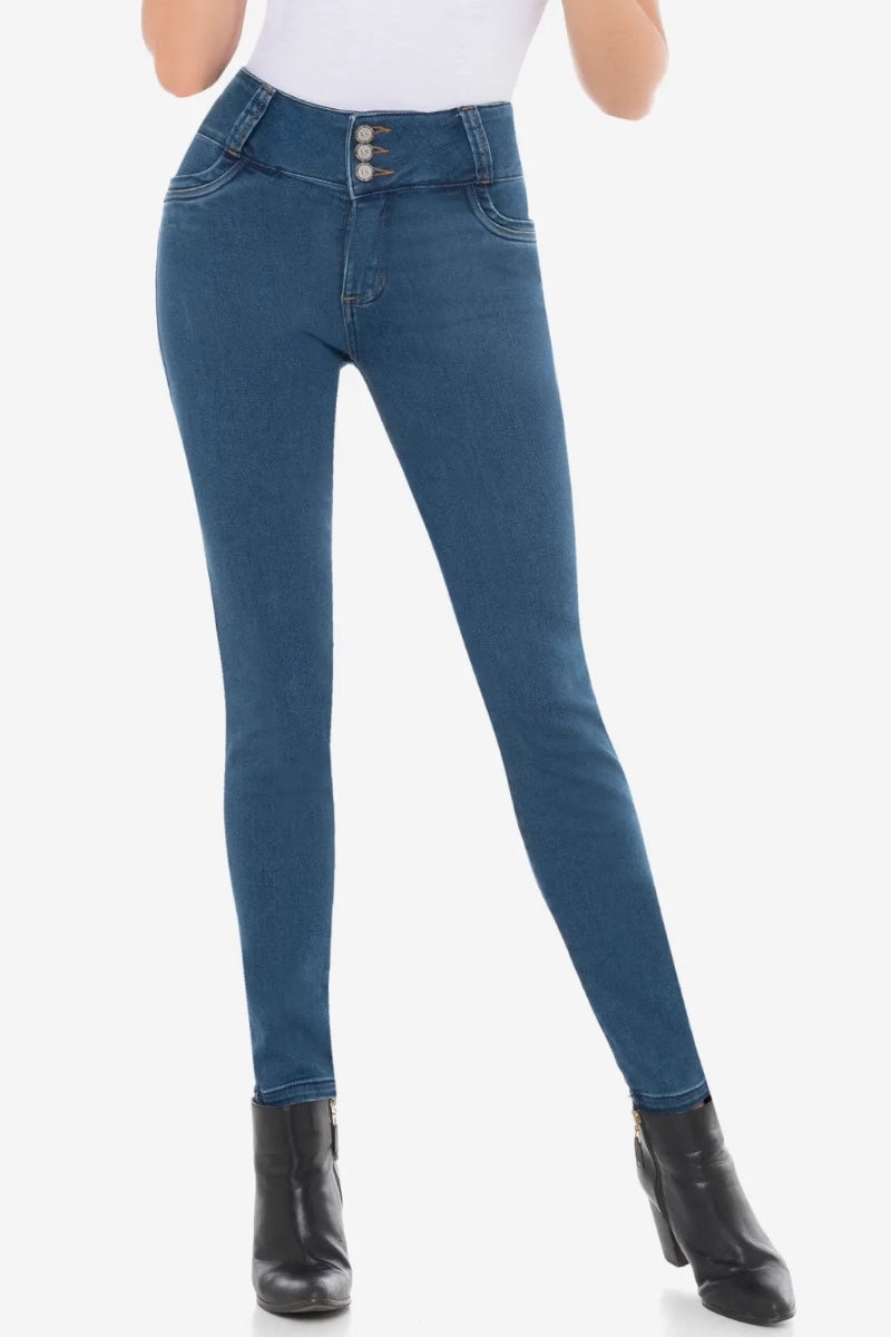 Blue jeans worn by a person on a white background