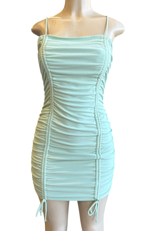 Mint green dress on a mannequin against a white background