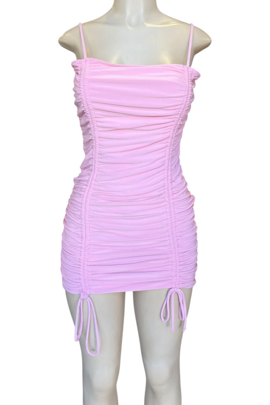 Pink dress on a mannequin against a white background