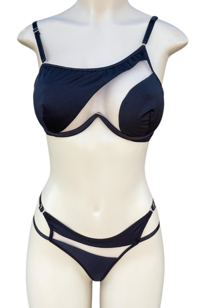 black bra top and panties set on a mannequin against a white background