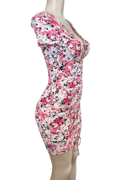 Pink Floral patterned dress on a mannequin against a white background