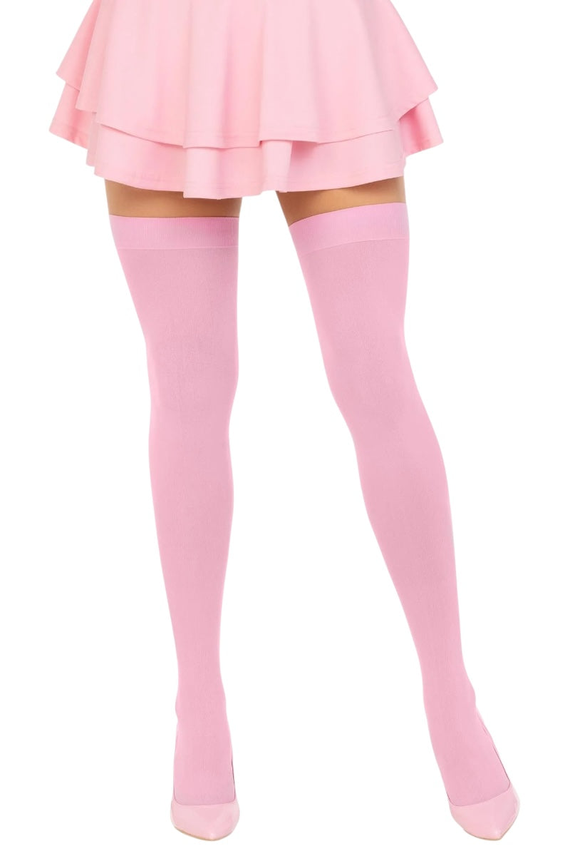 Person wearing pink knee-high socks and a matching skirt on a white background