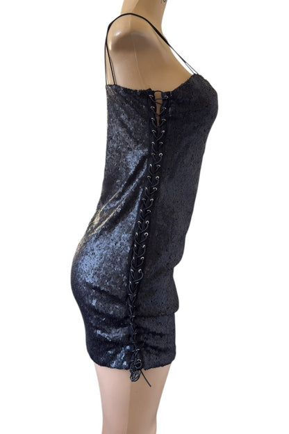 Black lace-up dress on a mannequin against a white background