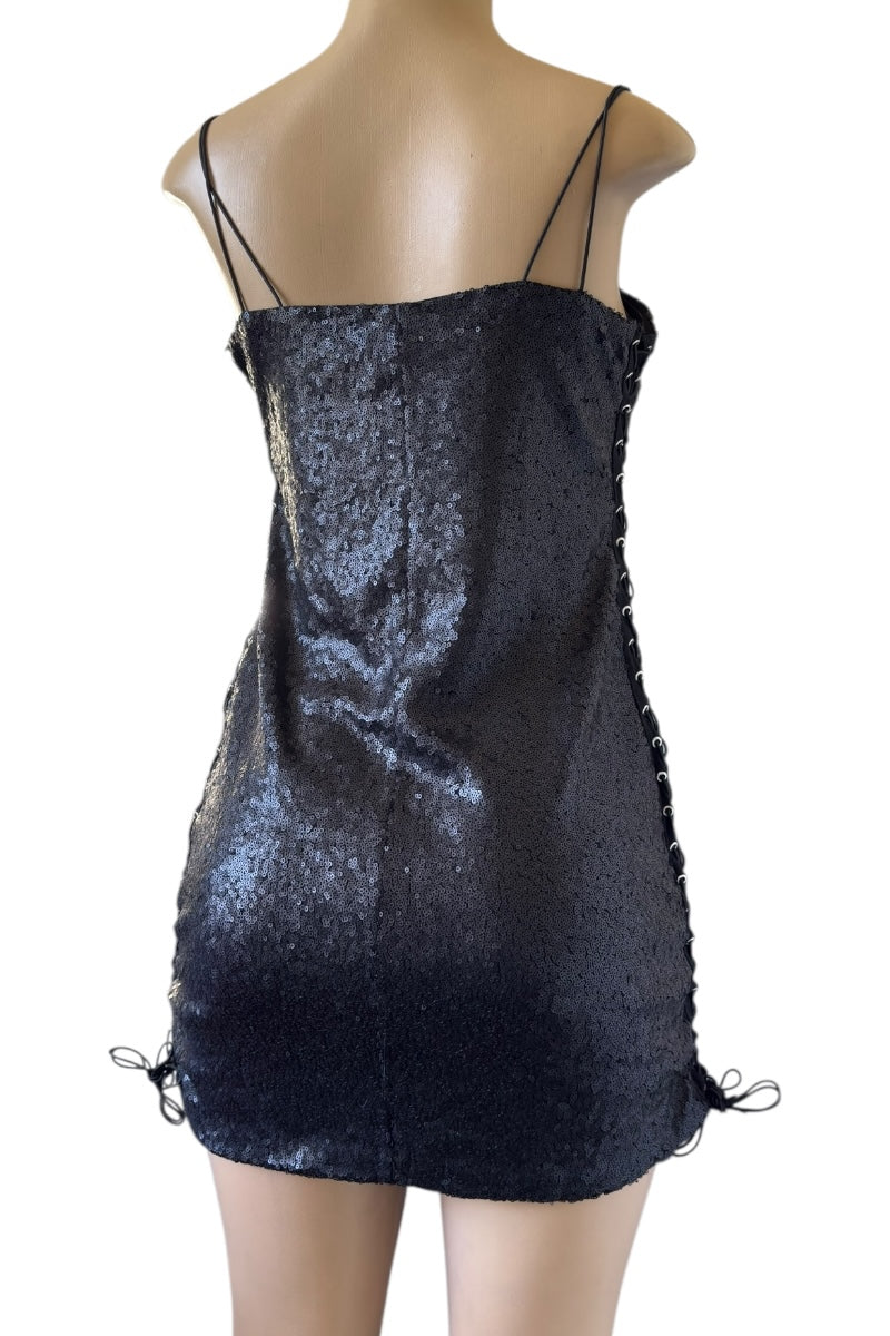 Black sequin dress on a mannequin against a white background