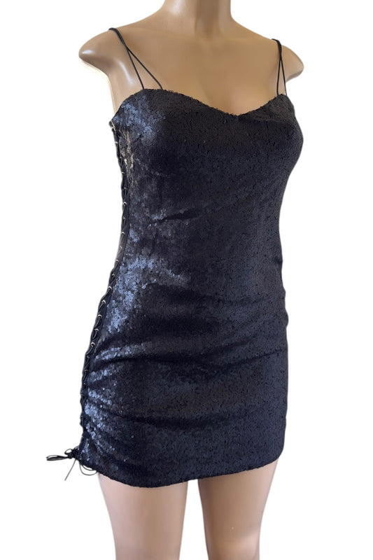 Black sequin dress on a mannequin against a white background