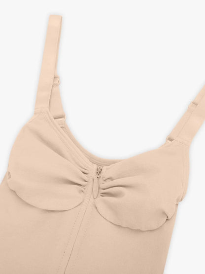 Beige top with a zipper detail on a white background
