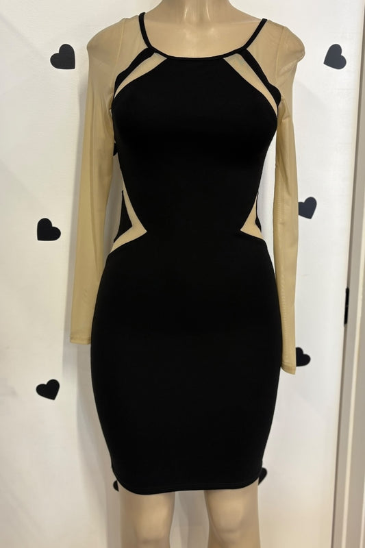 Black dress with beige long sleeves on a mannequin against a white background with black heart shapes.
